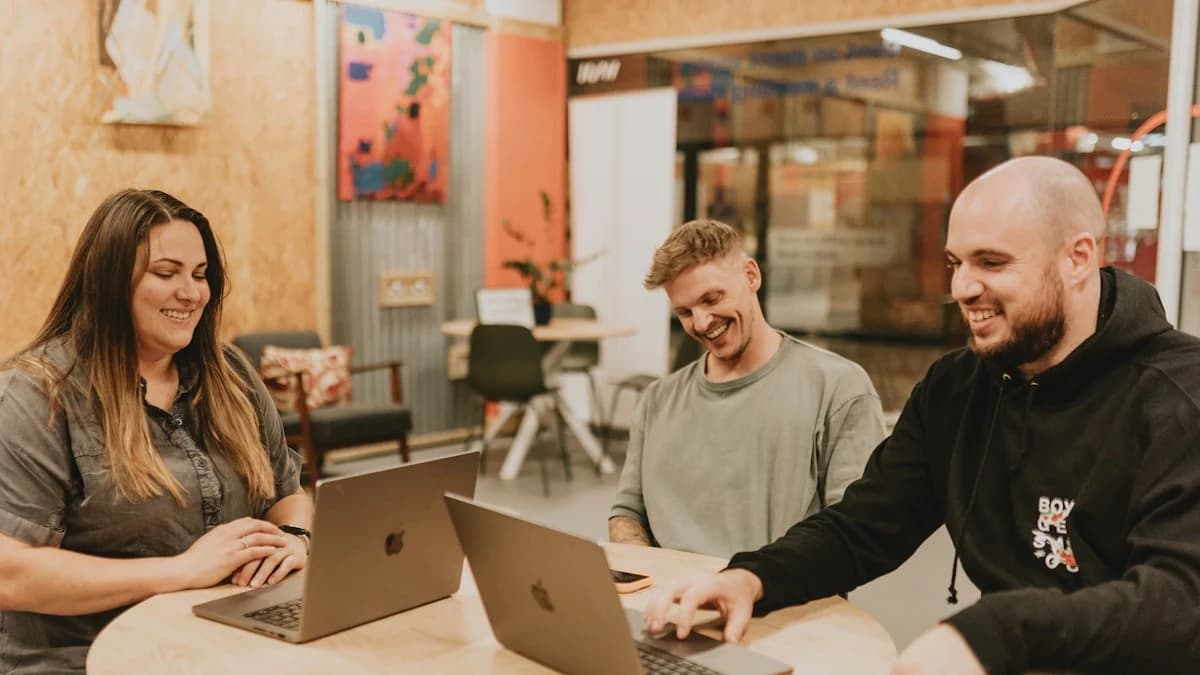 Vorapix use case — a three-person client studio working together across laptops at a shared table