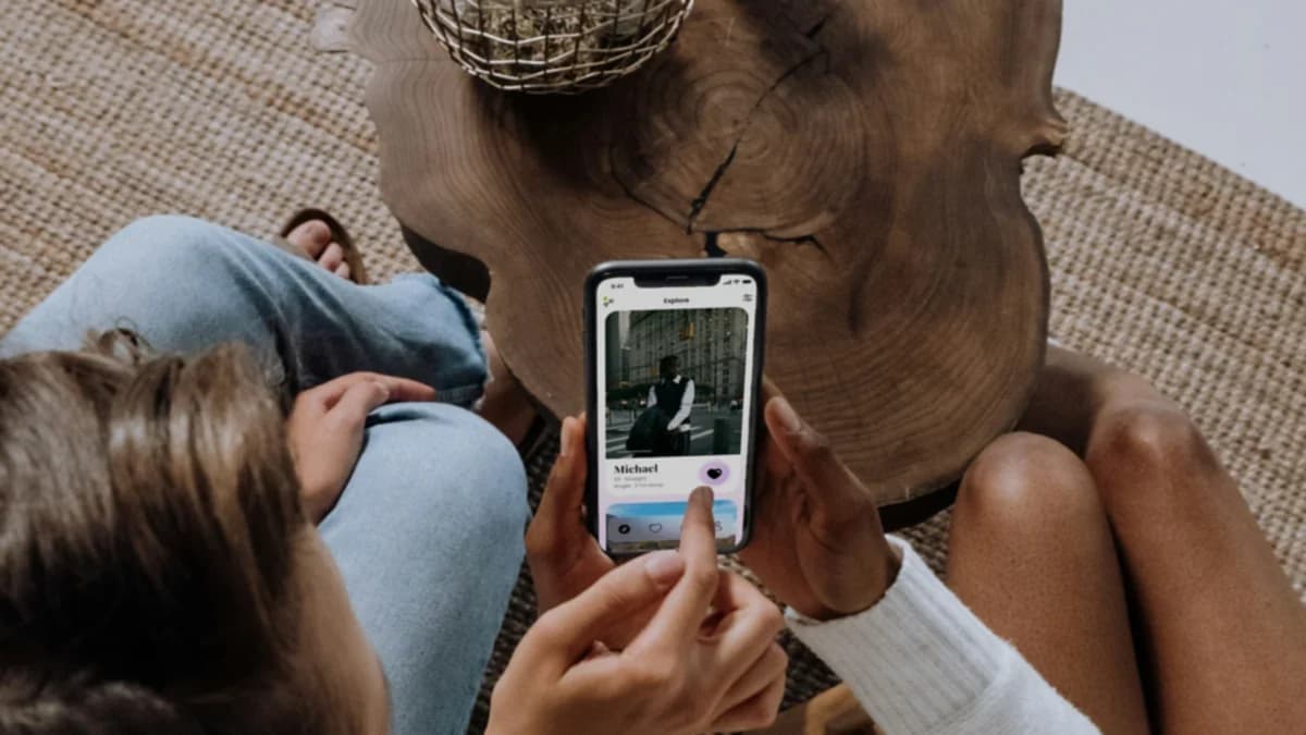 Two friends looking through photos on a phone
