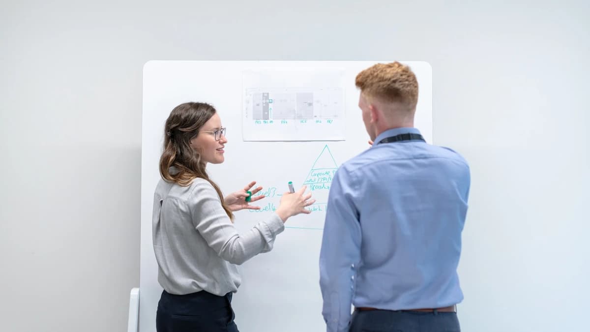 Two leads blocking a sequence out on a whiteboard