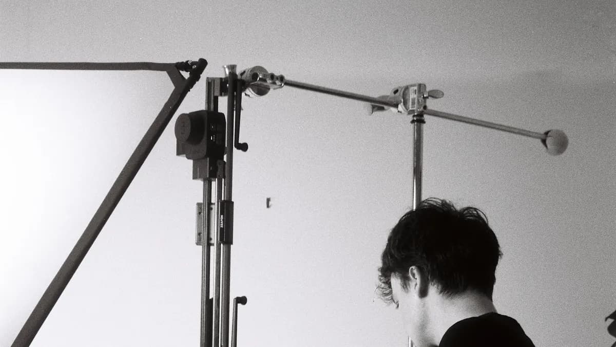 A boom light rigged over a product shot being staged
