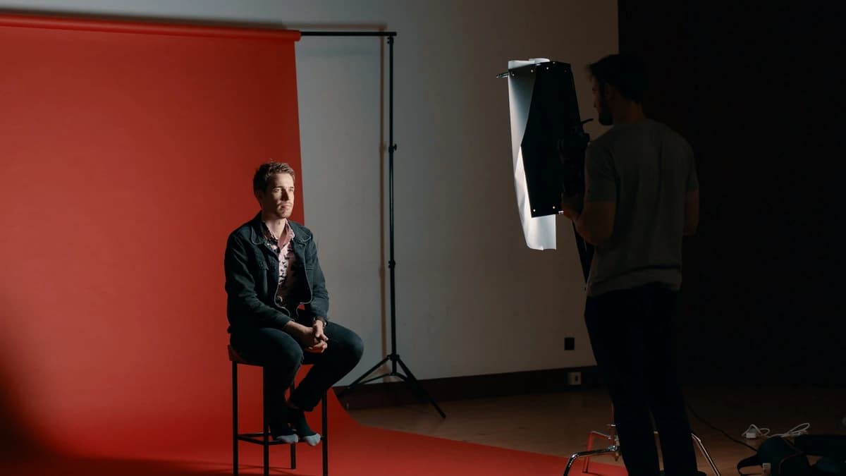 A headshot session running against a studio backdrop