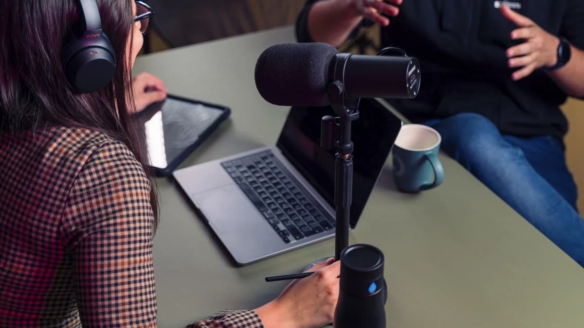 A creator tracking a read in headphones