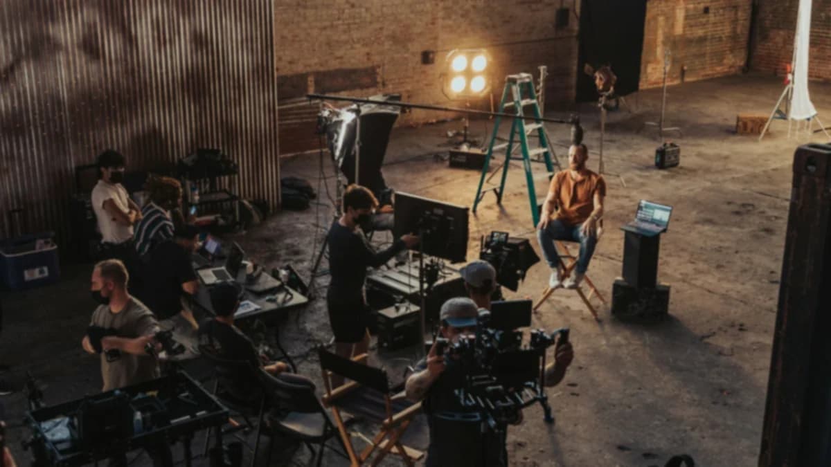 A small crew around a camera rig on set