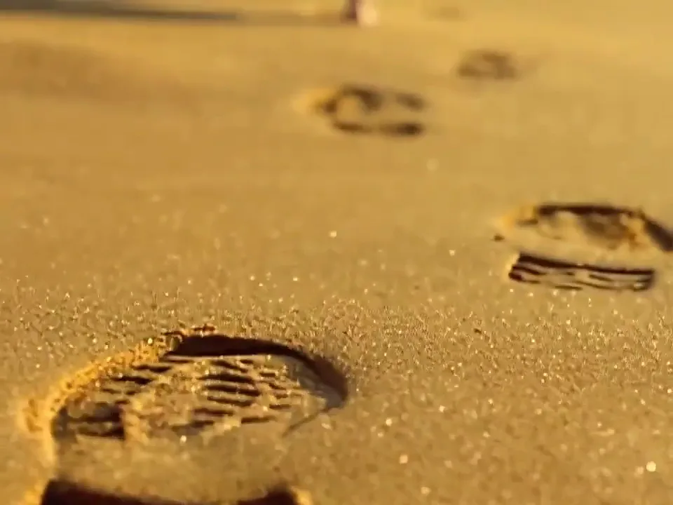 A Seedance sequence cutting from a chess board to desert sand to an aerial coastline